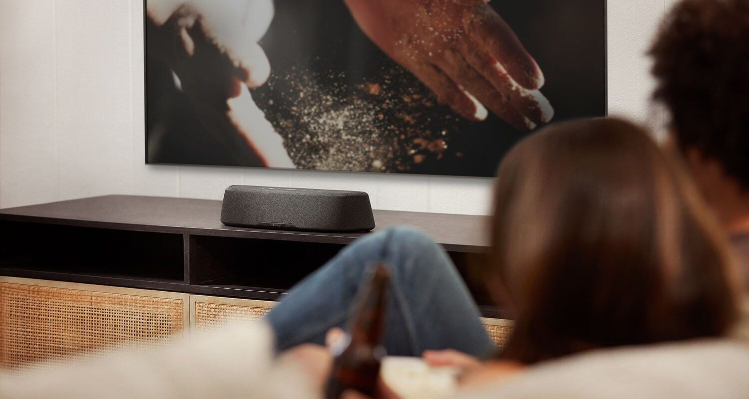 Compact soundbar sitting on a dresser.
