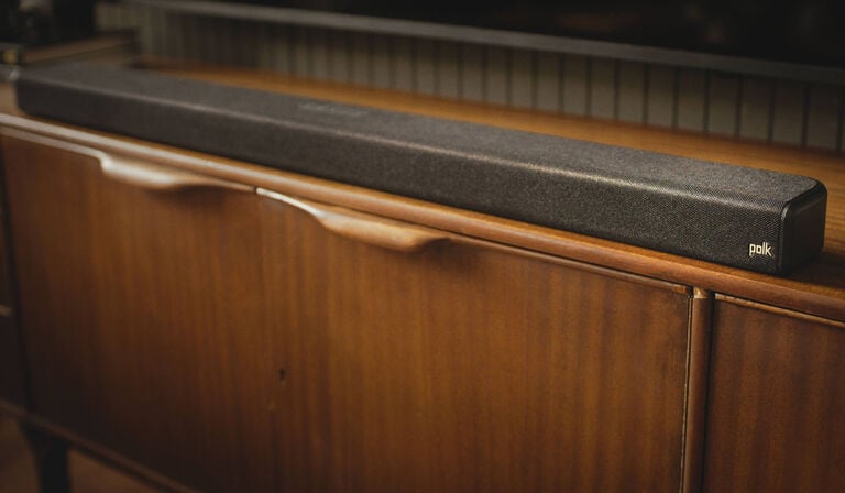 Soundbar sitting on a dresser. Soundbar sitting on a dresser.
