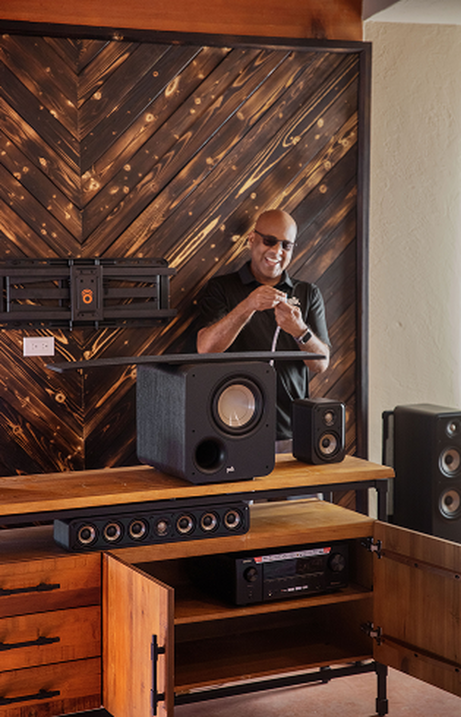 A man wiring a subwoofer